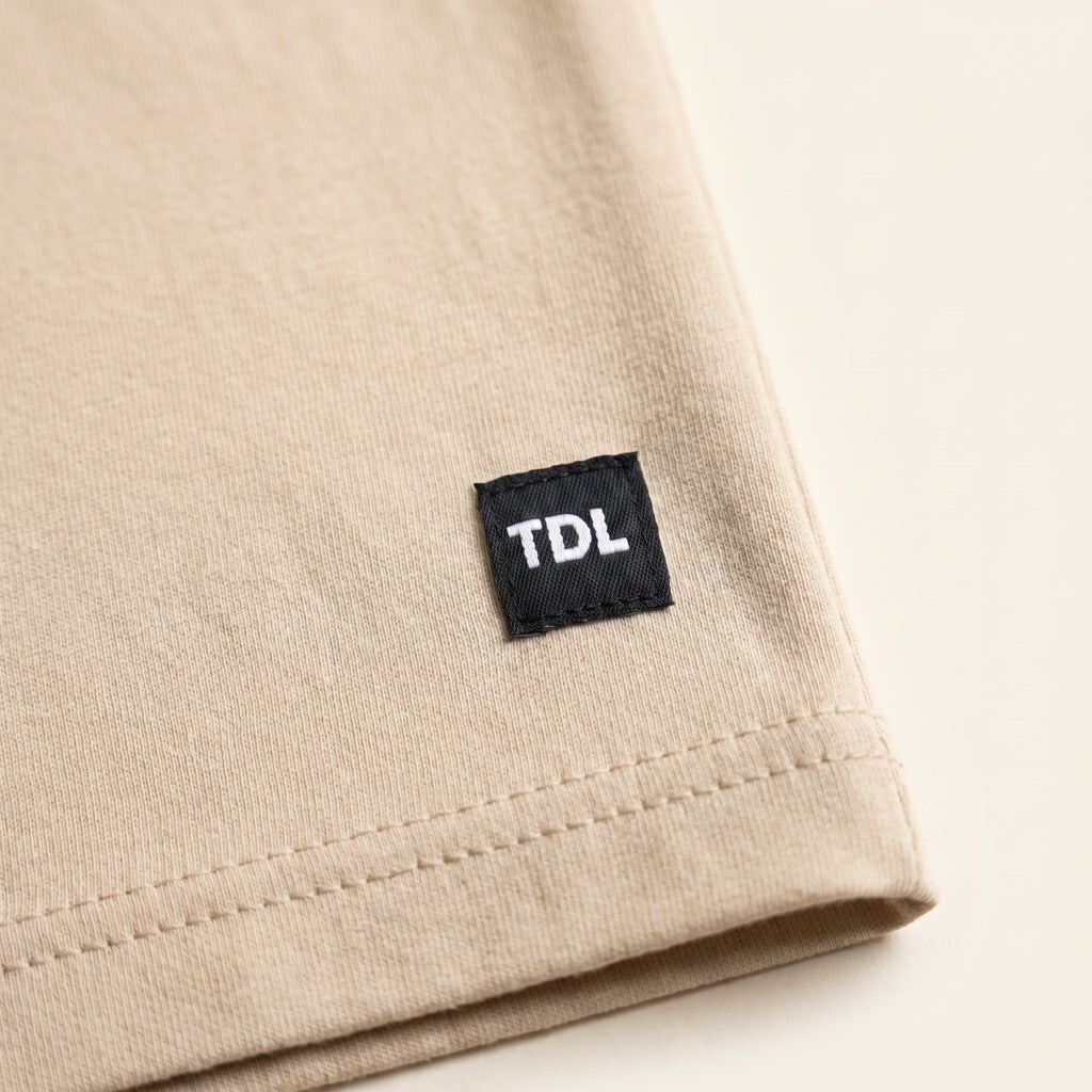 Sand beige regular-fit cotton tee — The Dirty Laundry Pakistan