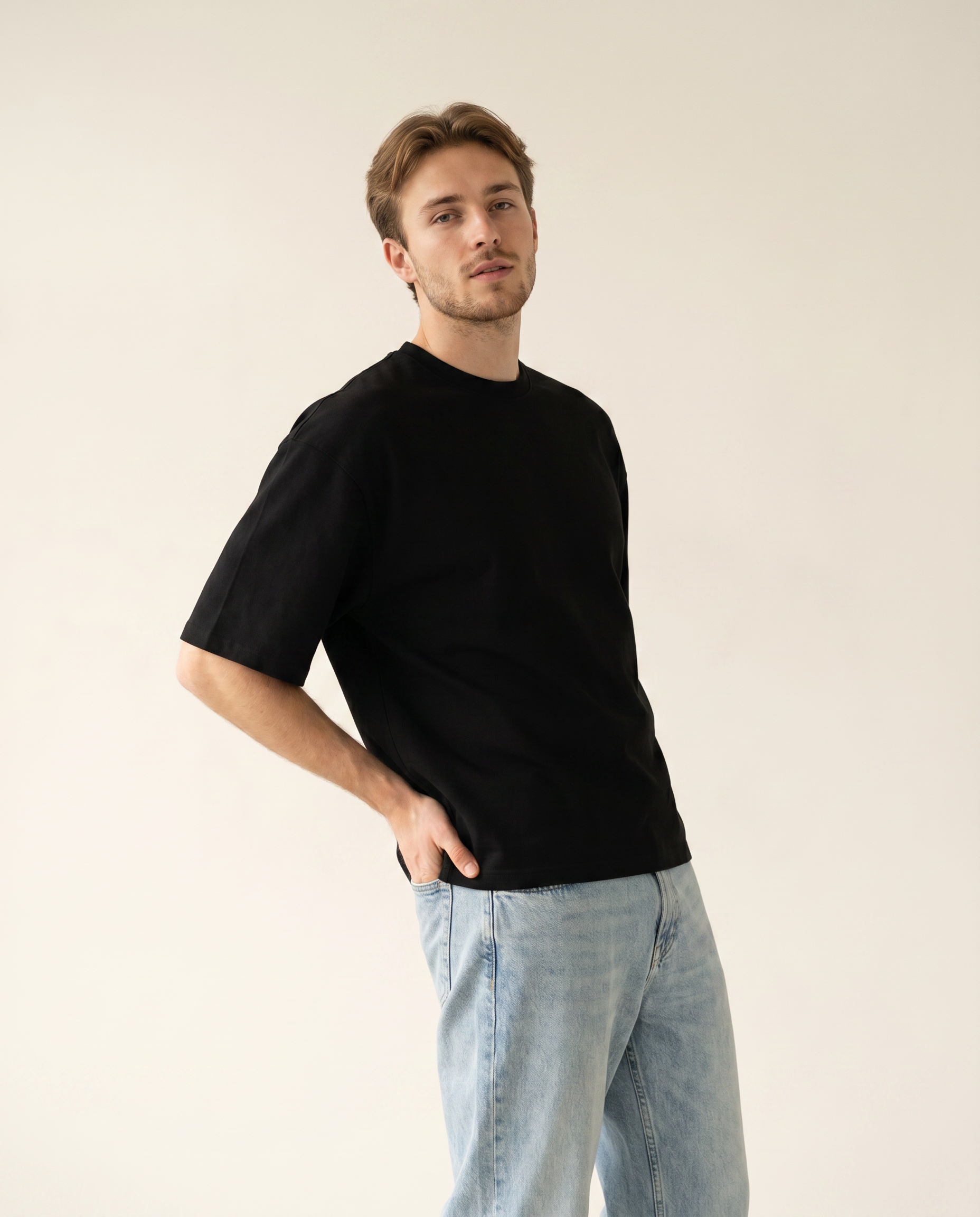 Noir black oversize viscose scuba tee — The Dirty Laundry Pakistan — on model