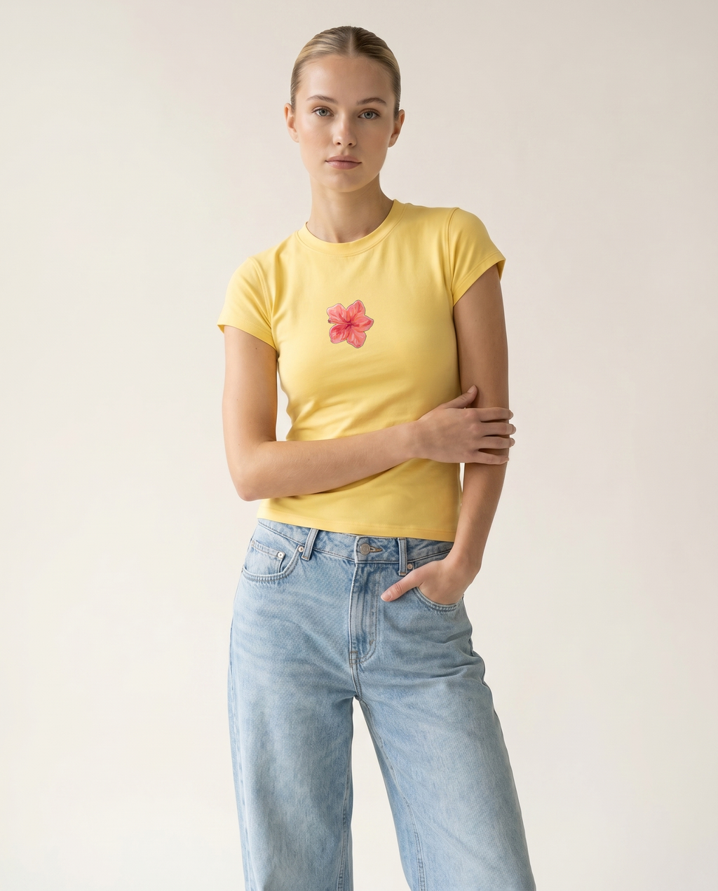 Butter Bloom fitted cap-sleeve tee with hand-painted hibiscus — The Dirty Laundry Pakistan