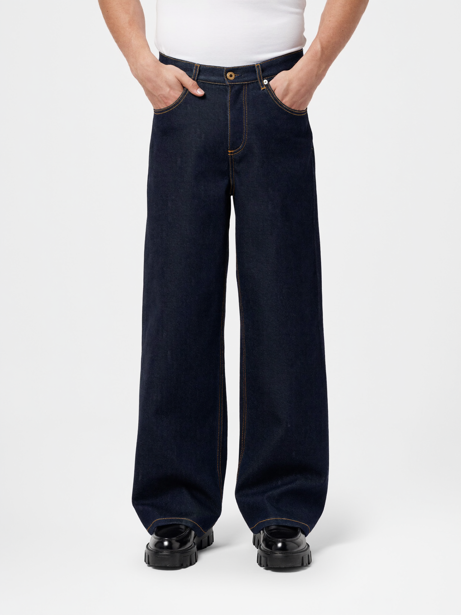 Raw indigo straight-leg denim jeans — The Dirty Laundry Pakistan — on model